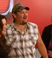 Larry the Cable Guy walks the red carpet at the CARS premiere.