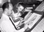 Beaumont beholds Marc Davis drawing Alice, in the PAN Platinum Edition feature 'You Can Fly: The Making of PETER PAN.'